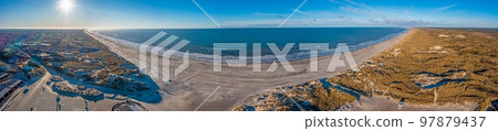 Drone panorama over Vejers beach in Denmark with sunshine and snow 97879437