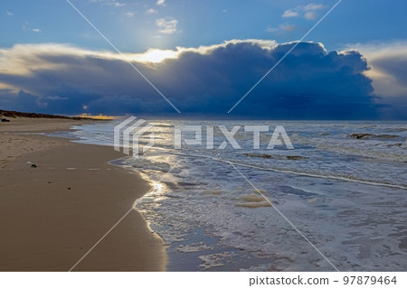 Winter image of a North Sea beach near Vejers at sunset 97879464