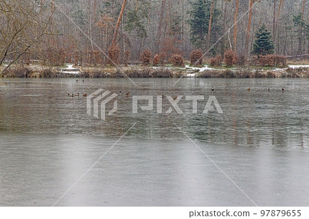 Panoramic image of frozen lake at frosty temperature during sunrise Panoramic image of frozen lake at frosty temperature during sunrise 97879655