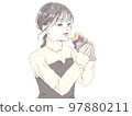 A woman who stuffs her mouth with delicious baked sweet potato 97880211