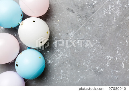 Background with fastive air balloons of round shape and confetti, multicoloured top view. Birthday party background 97880940