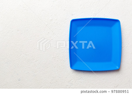Top view of empty square plate on cement background. Empty space for your design Top view of empty square plate on cement background. Empty space for your design 97880951