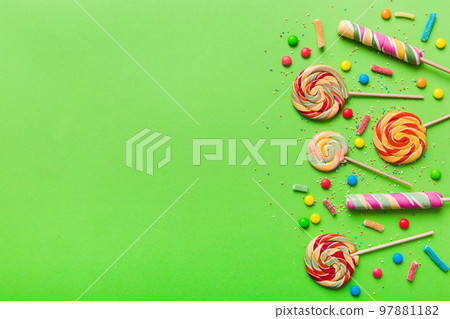 Tasty appetizing Party Accessories Happy Birthday Sweet. Different types of candies on colored background, copy space. Colorful birthday party background Tasty appetizing Party Accessories Happy Birthday Sweet. Different types of candies on colored background, copy space. Colorful birthday party background 97881182