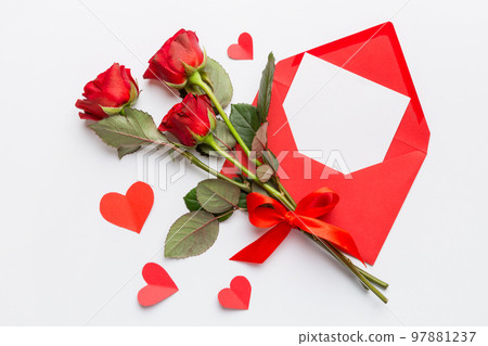 Valentine day composition with Envelope, rose flower and Red heart on table. Top view, flat lay. Holiday concept Valentine day composition with Envelope, rose flower and Red heart on table. Top view, flat lay. Holiday concept 97881237