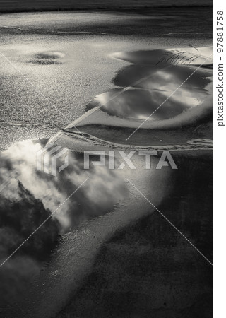 A ray of light shining into the cloudy sky 97881758