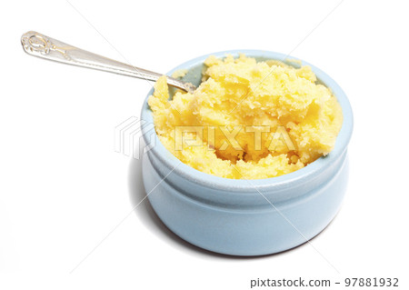 Ghee in a butter dish and spoon isolate on a white background Ghee in a butter dish and spoon isolate on a white background 97881932