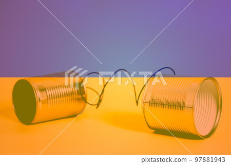 Double exposure of tin can phone with Flag of Ukraine Communication concept 97881943