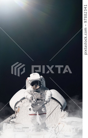 Astronaut and space background. Elements of this image furnished by NASA. Astronaut and space background. Elements of this image furnished by NASA. 97882341