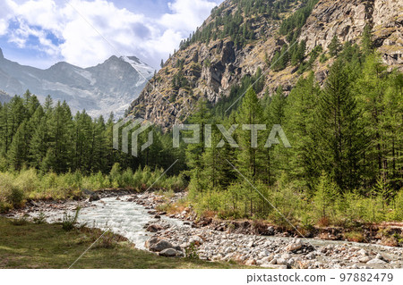 stream along rocky rapids in gorge between Italian Alps in Gran Paradiso National Park stream along rocky rapids in gorge between Italian Alps in Gran Paradiso National Park 97882479