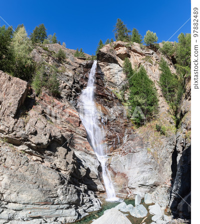 Lillaz waterfall (Cascate di Lillaz) rush down in Gran Paradiso National Park 97882489