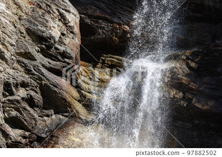 Lillaz waterfall (Cascate di Lillaz), sparkling with million bright splashes under day sunlight 97882502