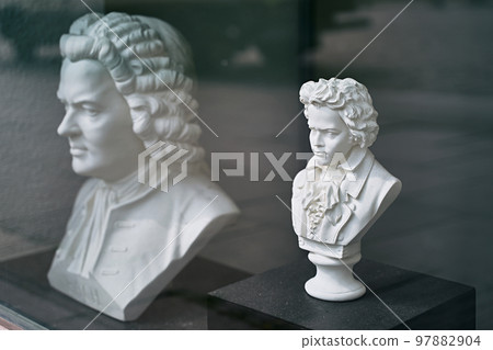White gypsum busts of Ludwig van Beethoven and Wolfgang Amadeus Mozart, famous composers White gypsum busts of Ludwig van Beethoven and Wolfgang Amadeus Mozart, famous composers 97882904