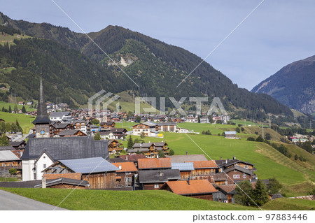 Idyllic landscape of village in Graubunden Canton, Swiss Alps, Switzerland Idyllic landscape of village in Graubunden Canton, Swiss Alps, Switzerland 97883446