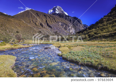 River and Huascaran massif in Cordillera Blanca, snowcapped Andes, Ancash, Peru 97883604