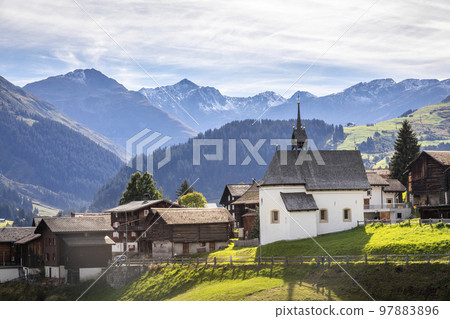 Idyllic landscape of village in Graubunden Canton, Swiss Alps, Switzerland Idyllic landscape of village in Graubunden Canton, Swiss Alps, Switzerland 97883896