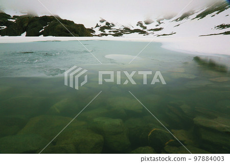 Melting frozen lake, Andes landscape in Tierra Del fuego, Ushuaia, Argentina 97884003
