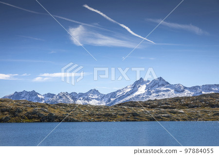 Alpine Lake at Oberalp Pass in Graubunden alps, Grisons, Switzerland 97884055