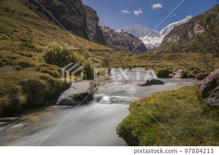 River and Huascaran massif in Cordillera Blanca, snowcapped Andes, Ancash, Peru 97884213