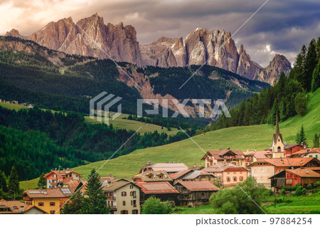 Langkofel and alpine village, Dolomites sudtirol near Cortina d Ampezzo 97884254