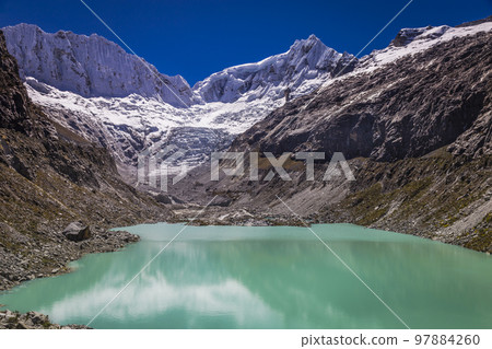 Llaca lake in Cordillera Blanca with snowcapped Andes, Ancash, Peru 97884260