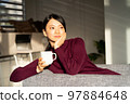 A woman relaxing at a workation 97884648