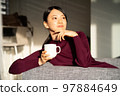A woman relaxing at a workation 97884649