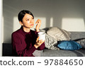 A woman relaxing at a workation 97884650