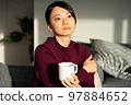 A woman relaxing at a workation 97884652