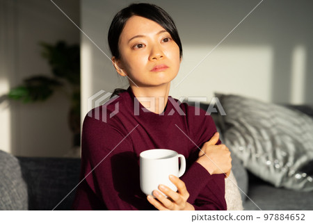 A woman relaxing at a workation A woman relaxing at a workation 97884652