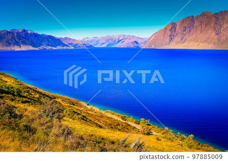 Lake Wakatipu coastline in south New Zealand, near Queenstown Lake Wakatipu coastline in south New Zealand, near Queenstown 97885009