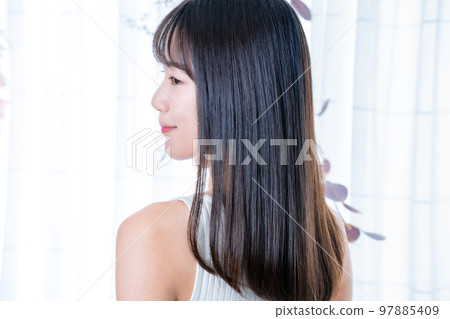 Rear view of a woman wearing a tank top 97885409