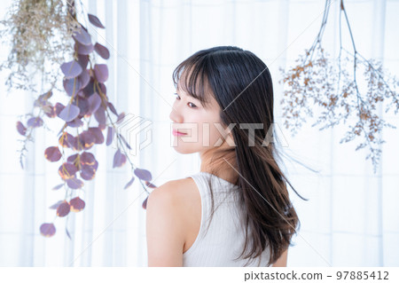 Rear view of a woman wearing a tank top 97885412