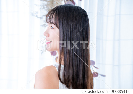 Rear view of a woman wearing a tank top 97885414