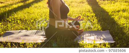 Banner pregnant woman meditating in nature, practice yoga copy space and empty place for text. Care of health and pregnancy Banner pregnant woman meditating in nature, practice yoga copy space and empty place for text. Care of health and pregnancy 97885606