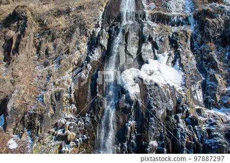 Early spring waterfall with ice Early spring waterfall with ice 97887297