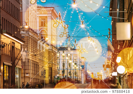 Helsinki, Finland. Light Blue Dramatic Sky. Night Evening Christmas Xmas New Year Festive Boke Illumination On Aleksanterinkatu Street. Beautiful Street Decorations During Winter Holiday. Bokeh Effect Helsinki, Finland. Light Blue Dramatic Sky. Night Evening Christmas Xmas New Year Festive Boke Illumination On Aleksanterinkatu Street. Beautiful Street Decorations During Winter Holiday. Bokeh Effect 97888418