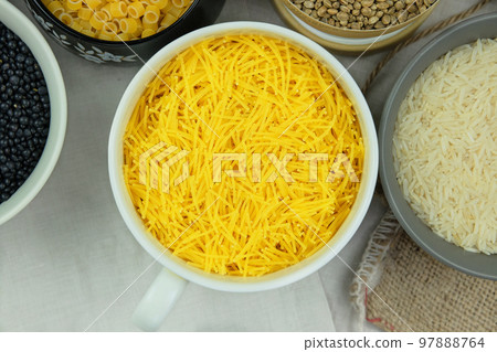 Noodles in bowl on a rural background. Vegetarian organic product. Top view. 97888764