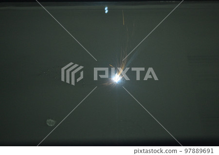 3D printer prints object from metal powder. Metal is sintered under laser into 3D shape in working chamber. Laser sintering machine for metal. Robotics work. Additive manufacturing metal 3D printer 97889691