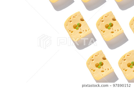 Creative cheese banner copy space. Maasdam with holes green leaf white background harsh shadow sunlight flat lay pattern 97890152
