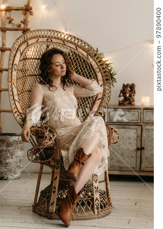 A young beautiful girl in a New Year's interior. A young beautiful girl in a New Year's interior. 97890400