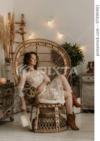 A young beautiful girl in a New Year's interior. A young beautiful girl in a New Year's interior. 97890401