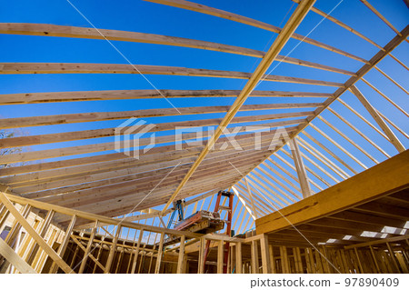 At wood framing beams that are being used in residential building construction constructed new house 97890409