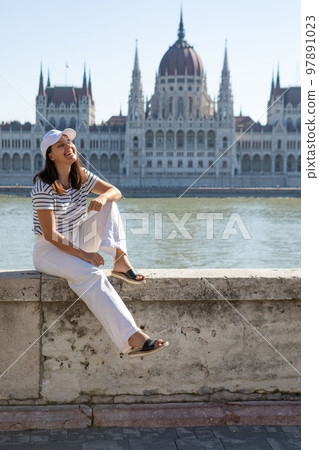 smiling woman portrait in front of Budapest parliament building smiling woman portrait in front of Budapest parliament building 97891023