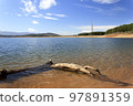 The Barcena reservoir with the chimneys of Compostilla thermal power station at background in Cubillos del Sil, el Bierzo, Castile and Leon, Spain. 97891359