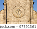 Rosette window in the facade of the Main Church of Our Lady of the Assumption in Caminha, Portugal. 97891361