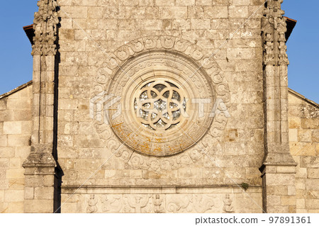 Rosette window in the facade of the Main Church of Our Lady of the Assumption in Caminha, Portugal. 97891361