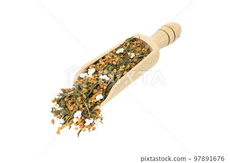 Green tea Japanese Genmaicha. Green tea mixed with roasted popped brown rice  in wooden scoop isolated on white background. 97891676