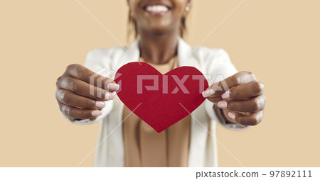 Crop of black woman hold in hands red paper heart 97892111
