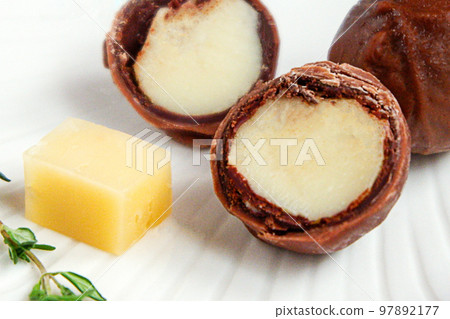Chocolate-covered cheese, chocolate balls stuffed with cheese. Trendy dessert. Chocolate-covered cheese, chocolate balls stuffed with cheese. Trendy dessert. 97892177