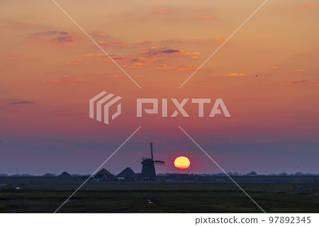 Sunrise with windmill Hargermolen, Bergen - Schoorl, The Netherlands Sunrise with windmill Hargermolen, Bergen - Schoorl, The Netherlands 97892345